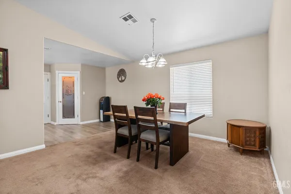 a dining room with furniture and window