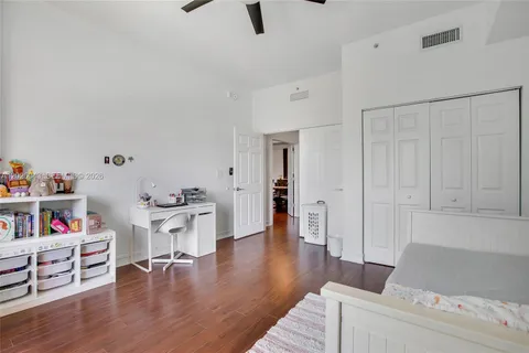 a view of staircase with white walls and a window