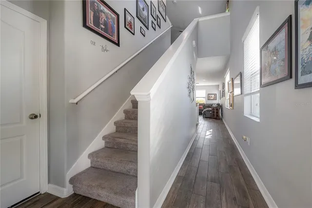 a bedroom with a bed and a view of kitchen