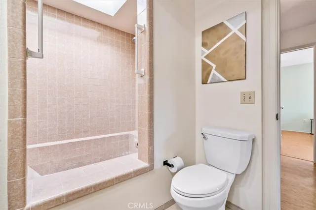 a bedroom with a bed and chair