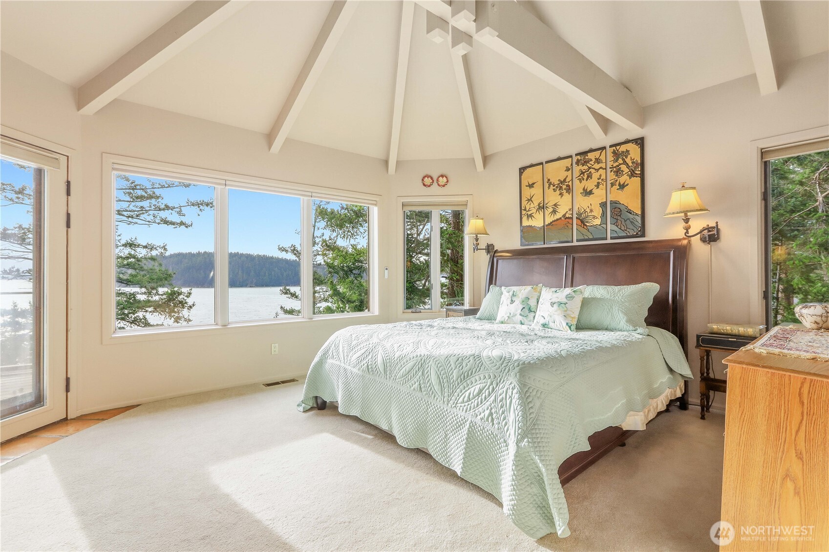 736 Tillamuk Drive La Conner, WA 98257 - Photo 14 of 34 a bed sitting in a bedroom next to a window