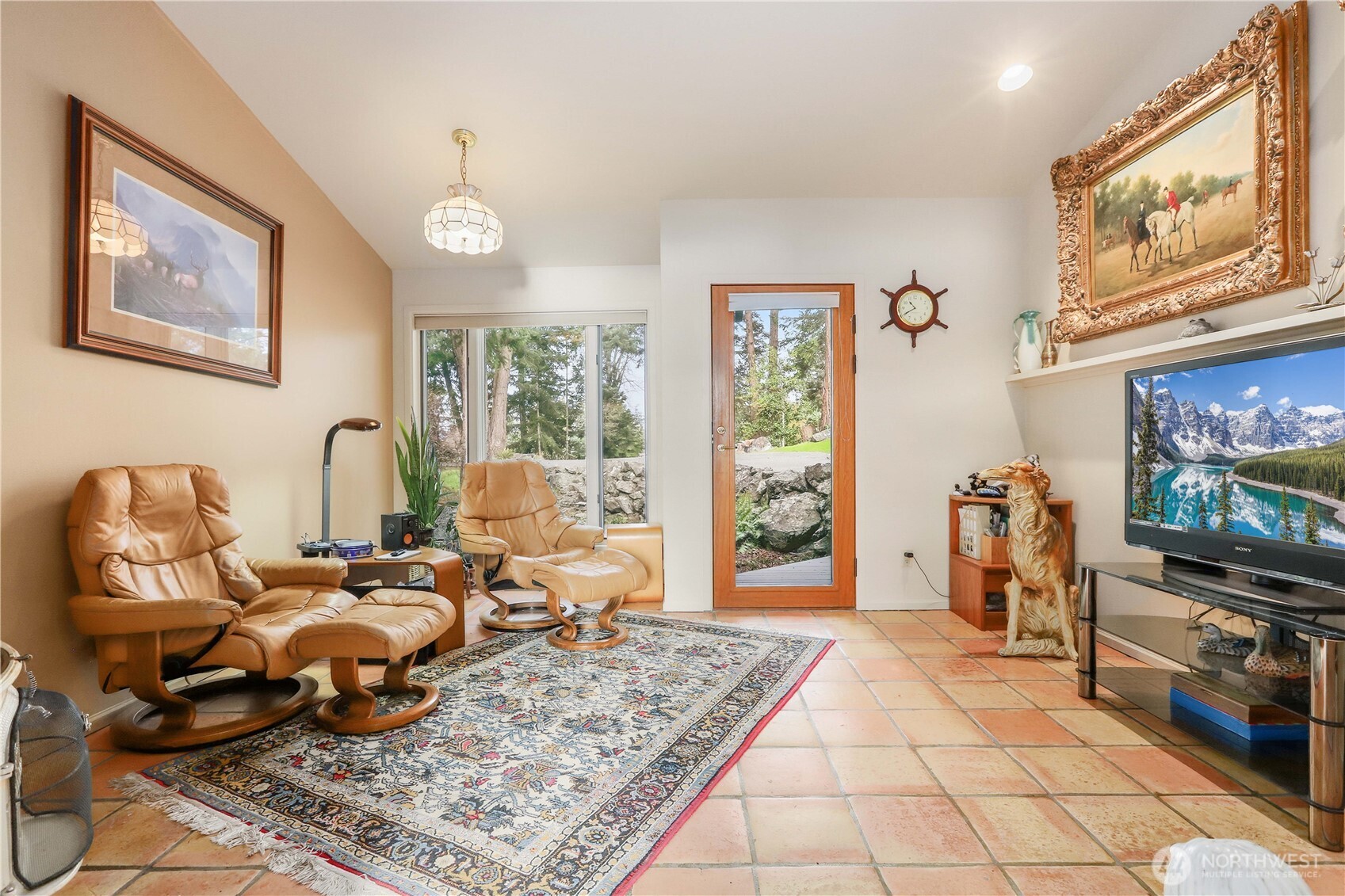 736 Tillamuk Drive La Conner, WA 98257 - Photo 20 of 34 a living room with furniture and a flat screen tv