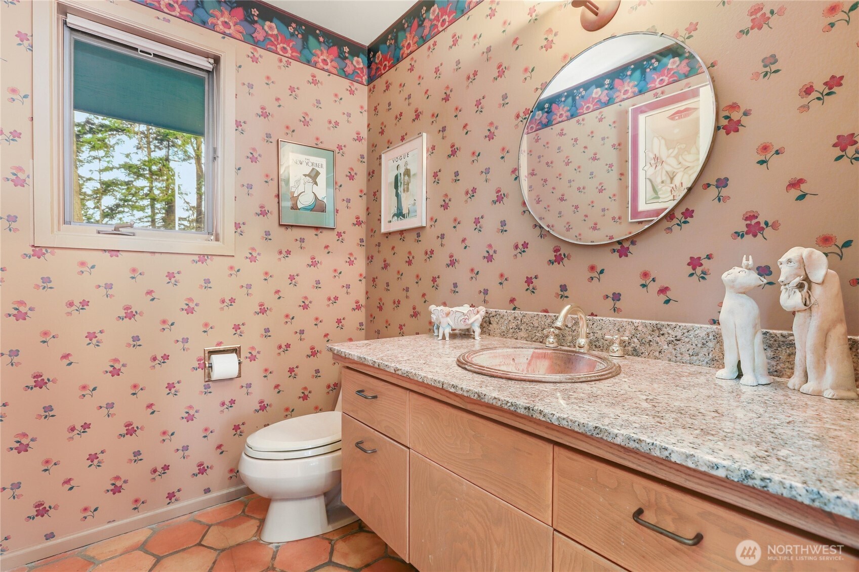 736 Tillamuk Drive La Conner, WA 98257 - Photo 26 of 34 a bathroom with a granite countertop toilet a sink a mirror and a shower