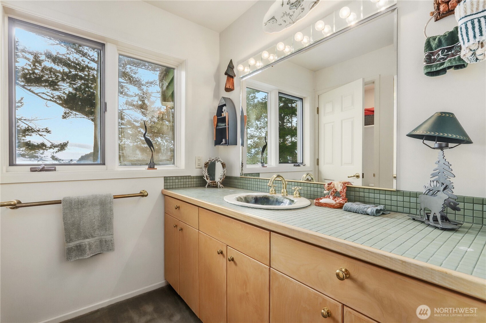 736 Tillamuk Drive La Conner, WA 98257 - Photo 30 of 34 a hallway with sink and large window