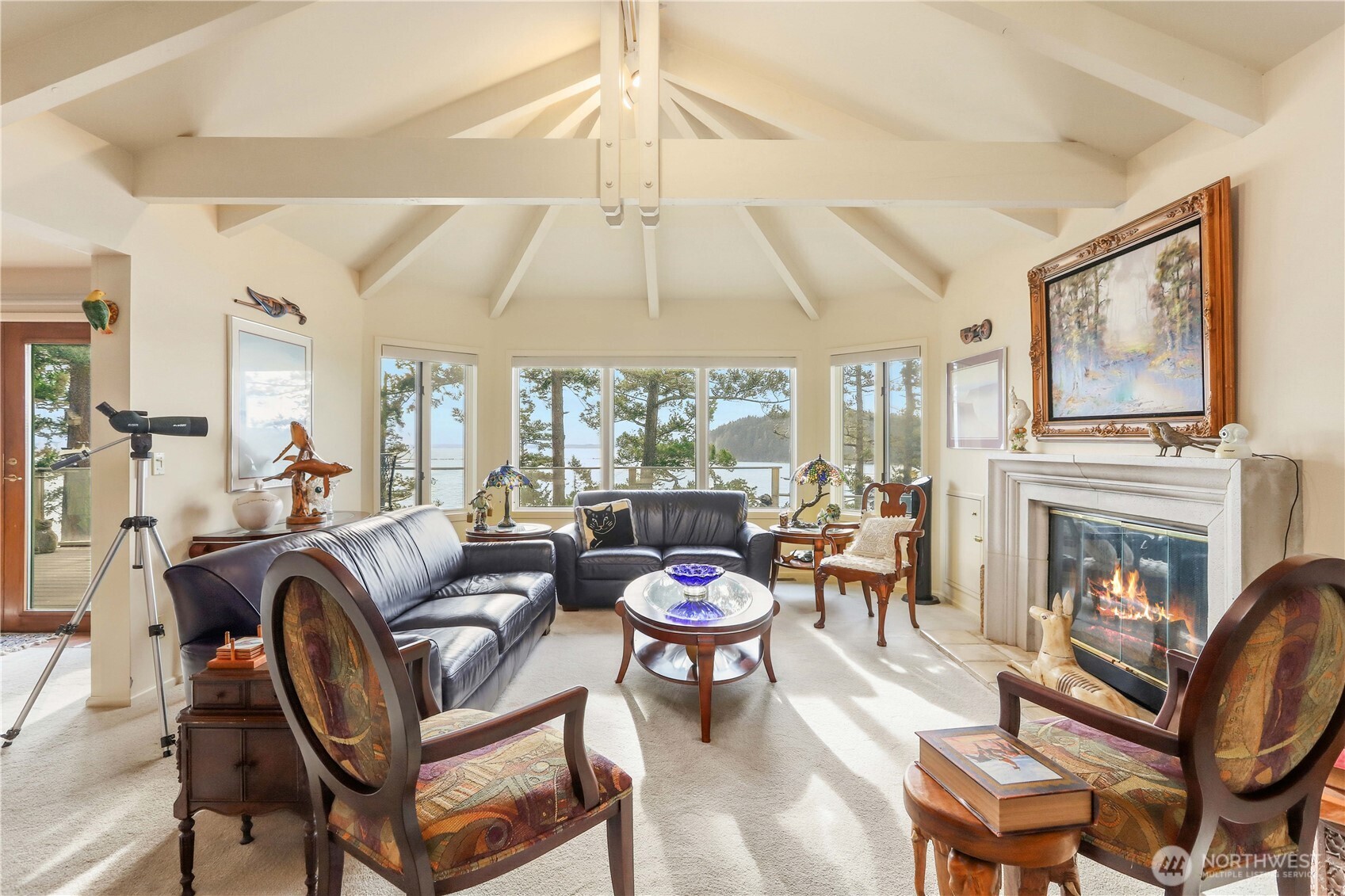 736 Tillamuk Drive La Conner, WA 98257 - Photo 4 of 34 a living room with fireplace furniture and a large window