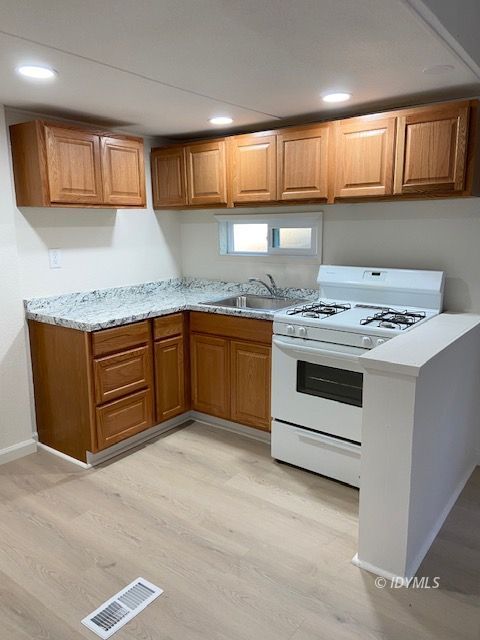 52791 Pine Cove Road Idyllwild, CA 92549 - Photo 3 of 8 a kitchen with stainless steel appliances granite countertop a sink stove and cabinets