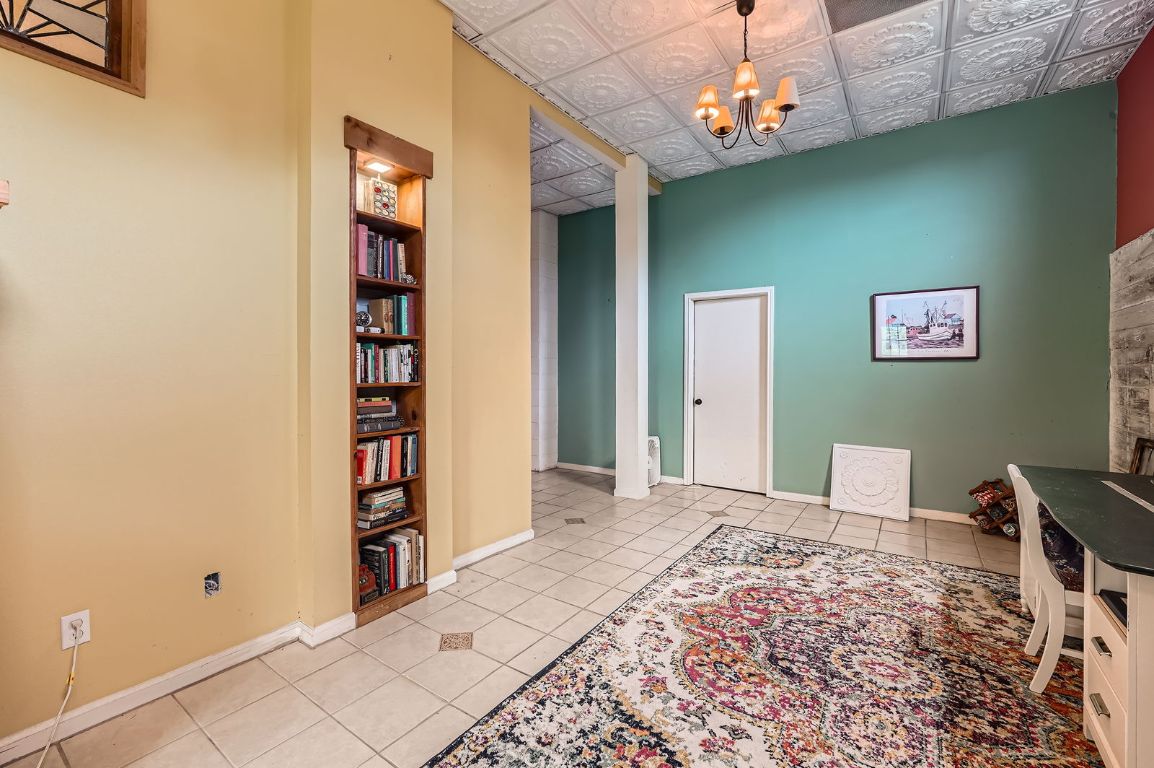 760 Skyline Ridge Lookout Wimberley, TX 78676 - Photo 18 of 40 Tiled office featuring a chandelier, an ornate ceiling, and built in features