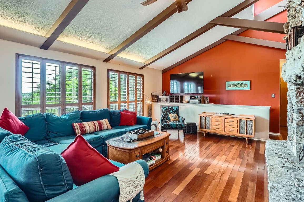 760 Skyline Ridge Lookout Wimberley, TX 78676 - Photo 3 of 40 Living room featuring hardwood / wood-style flooring, a textured ceiling, and a ceiling fan