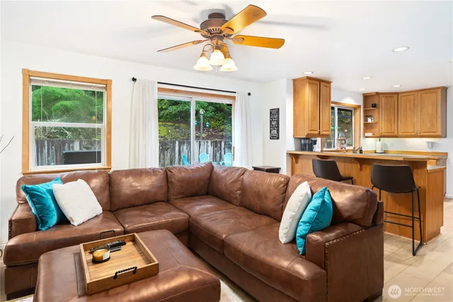 a living room with furniture and a large window