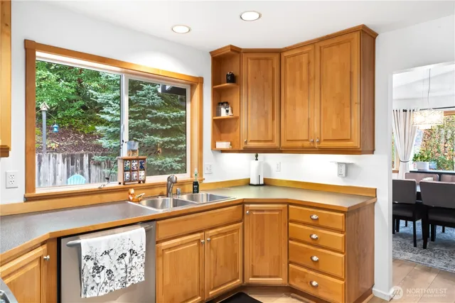 a kitchen with a sink and a large window