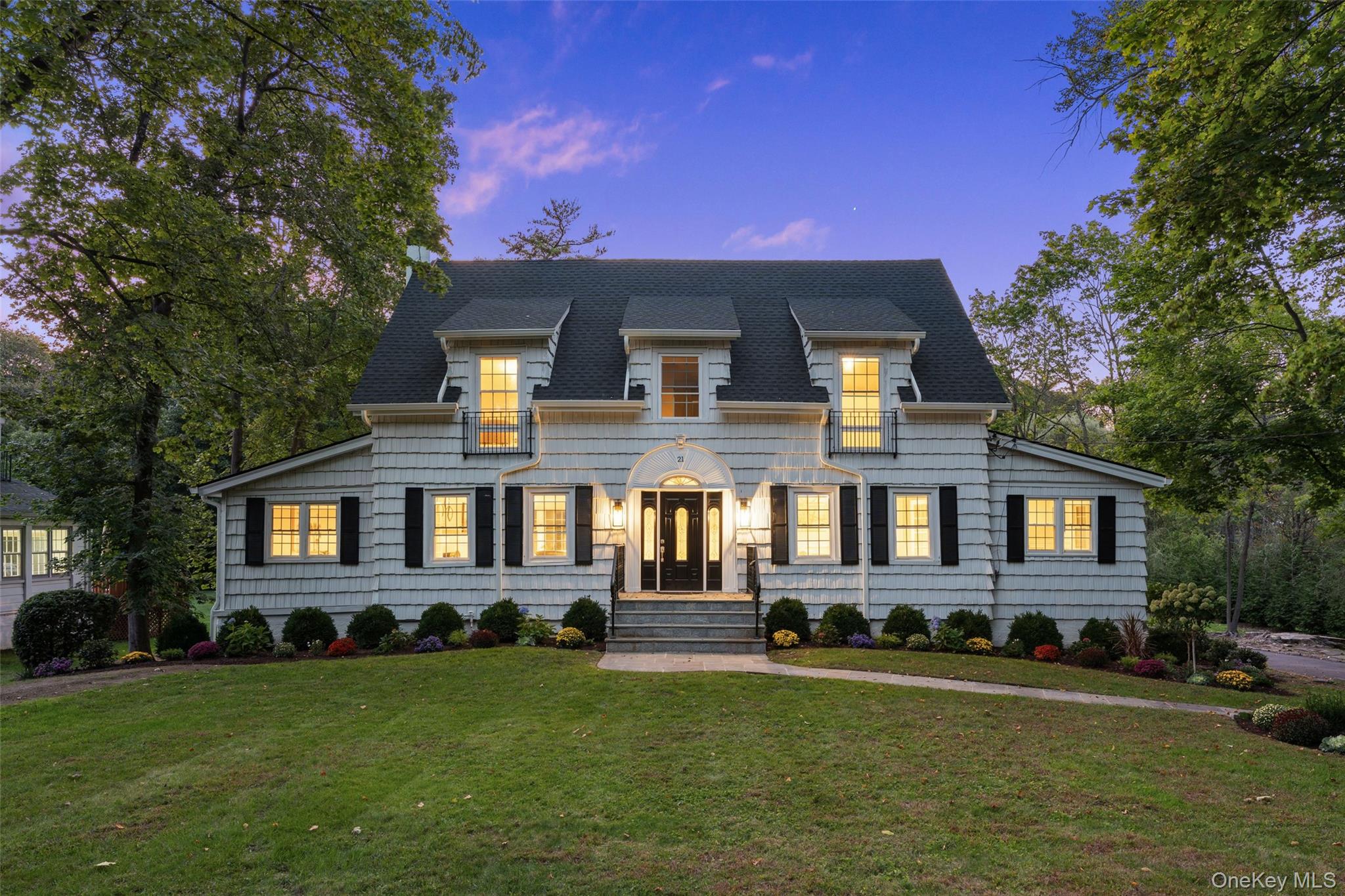 21 Cambridge Road Scarsdale, NY 10583 - Photo 1 of 1 View of front of home featuring a lawn and roof with shingles