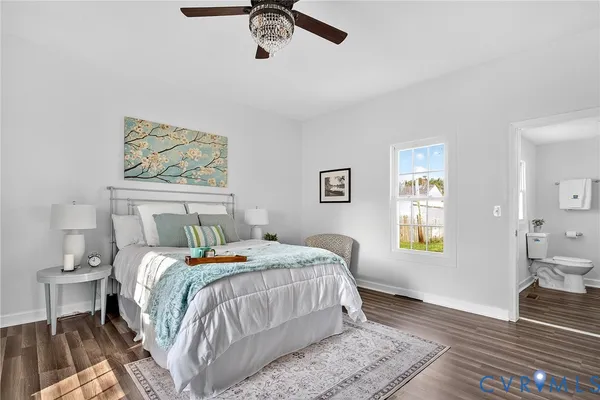 a bedroom with a bed and a chair