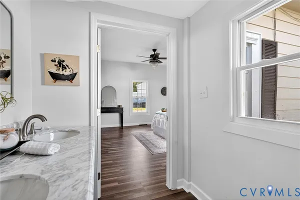 a bedroom with bed and window