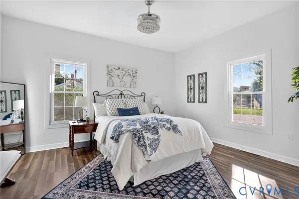 a bedroom with furniture and a window
