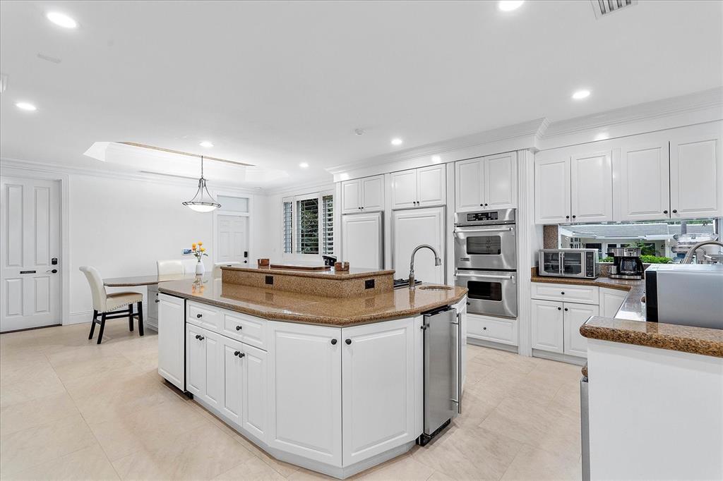 414 Riviera Isle Drive Fort Lauderdale, FL 33301 - Photo 21 of 70 a kitchen with stainless steel appliances granite countertop a sink and cabinets