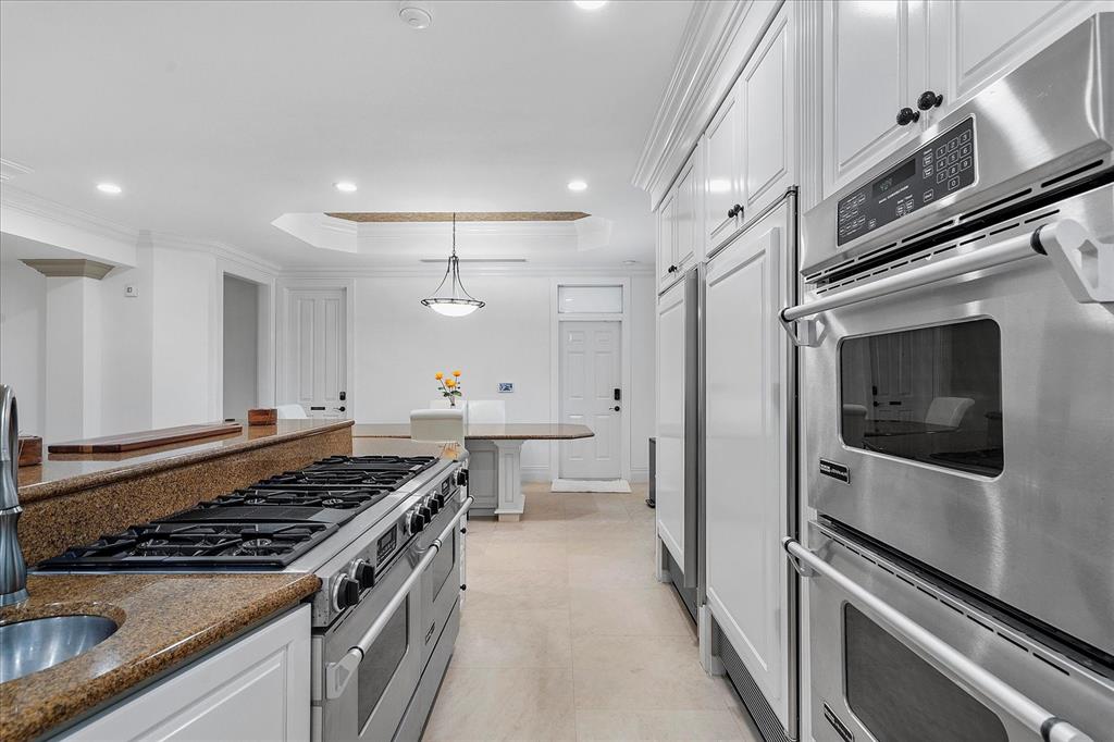 414 Riviera Isle Drive Fort Lauderdale, FL 33301 - Photo 22 of 70 a kitchen with stainless steel appliances a stove a sink and a refrigerator