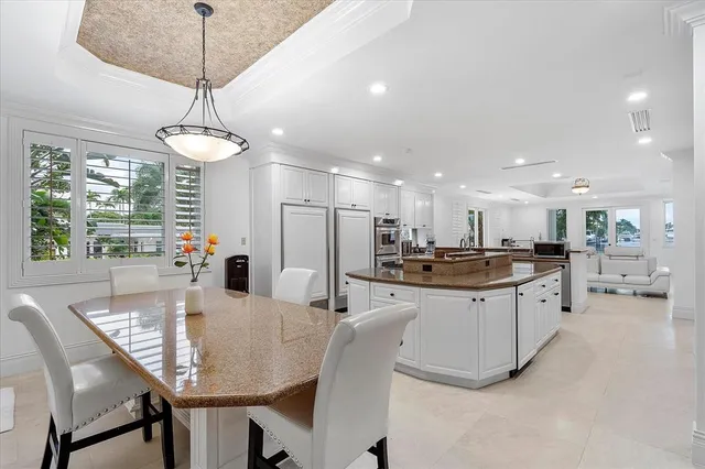 a spacious bedroom with a large bed and a flat screen tv