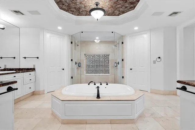 a view of a house with pool and sitting area