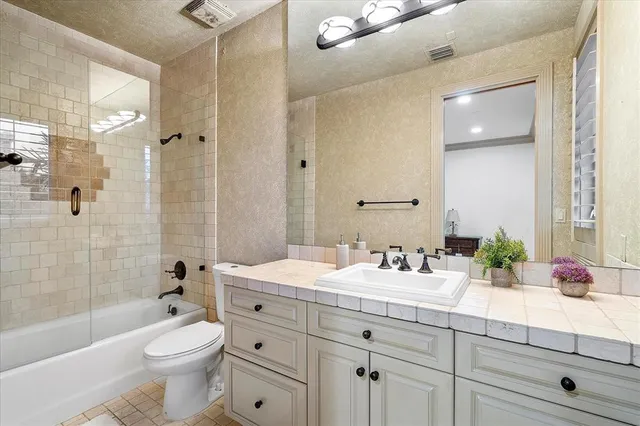 a view of a house with pool and sitting area