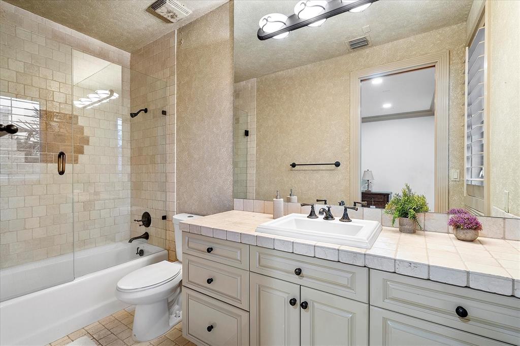 414 Riviera Isle Drive Fort Lauderdale, FL 33301 - Photo 34 of 70 a bathroom with a double vanity sink toilet mirror and bathtub