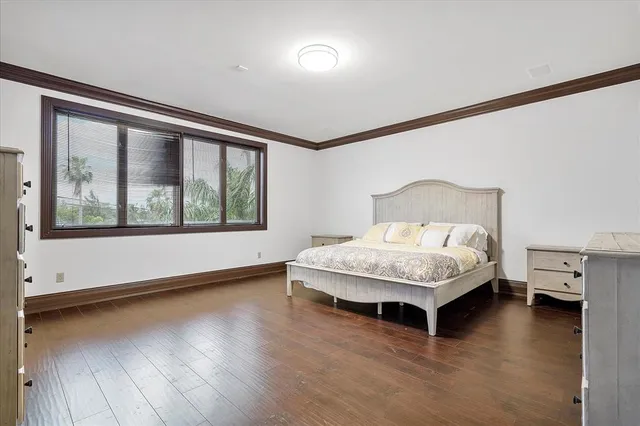 a view of a balcony with furniture and floor to ceiling window
