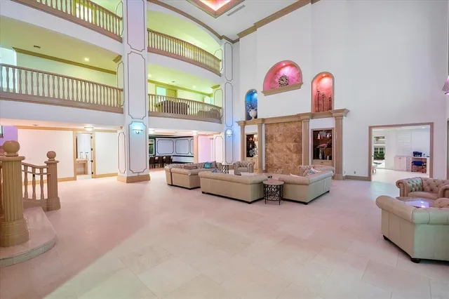 a view of a swimming pool with outdoor seating and deck