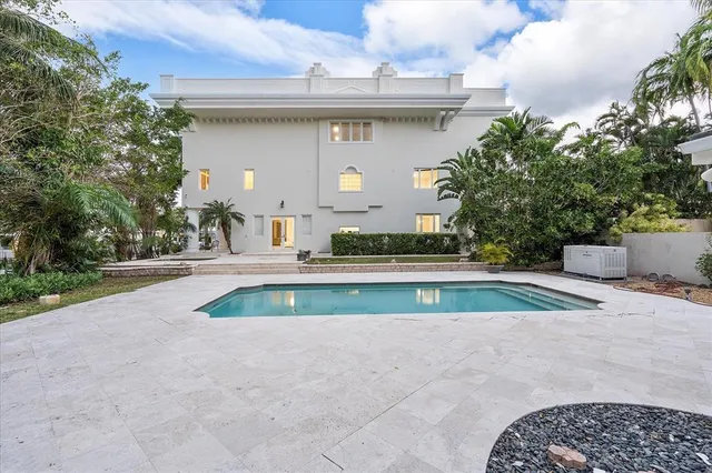 a front view of a house with a yard and a garage