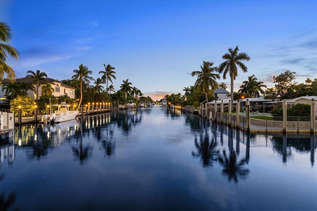 414 Riviera Isle Drive Fort Lauderdale, FL 33301 - Photo 59 of 70 a view of a swimming pool with outdoor seating and deck