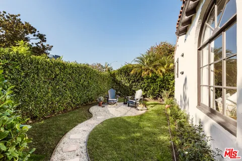 a view of a swimming pool with a garden