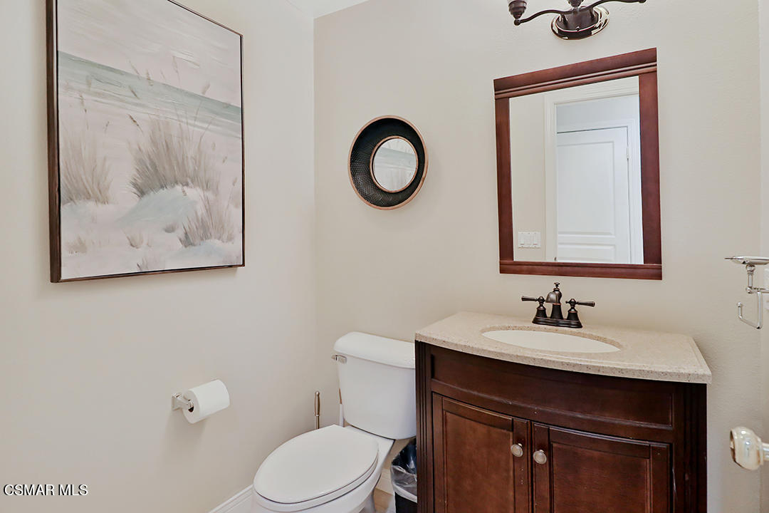151 Brooks Road Simi Valley, CA 93065 - Photo 16 of 56 a bathroom with a sink vanity and toilet