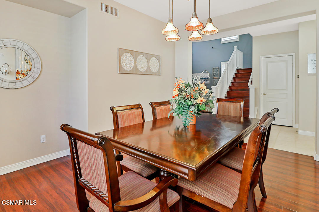 151 Brooks Road Simi Valley, CA 93065 - Photo 18 of 56 a view of a dining room with furniture and wooden floor