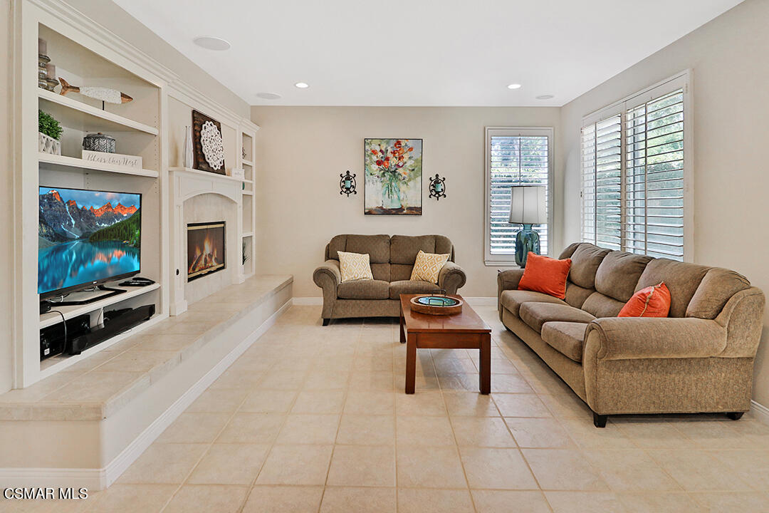 151 Brooks Road Simi Valley, CA 93065 - Photo 19 of 56 a living room with furniture a flat screen tv and a fireplace