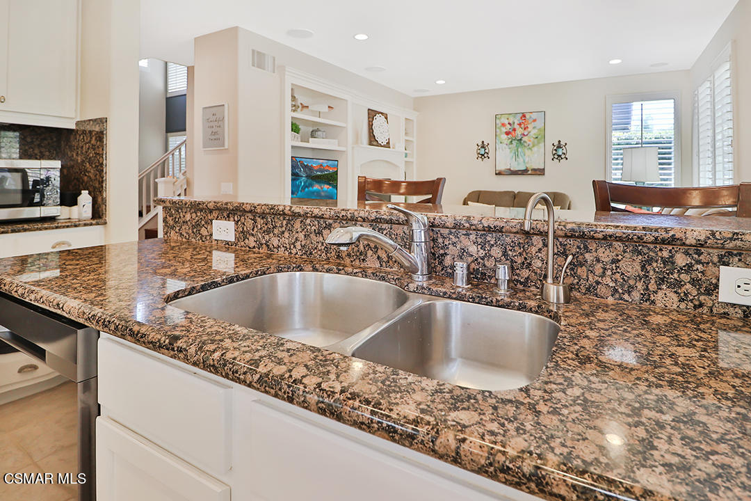 151 Brooks Road Simi Valley, CA 93065 - Photo 23 of 56 a kitchen with granite countertop a sink and a stove top oven