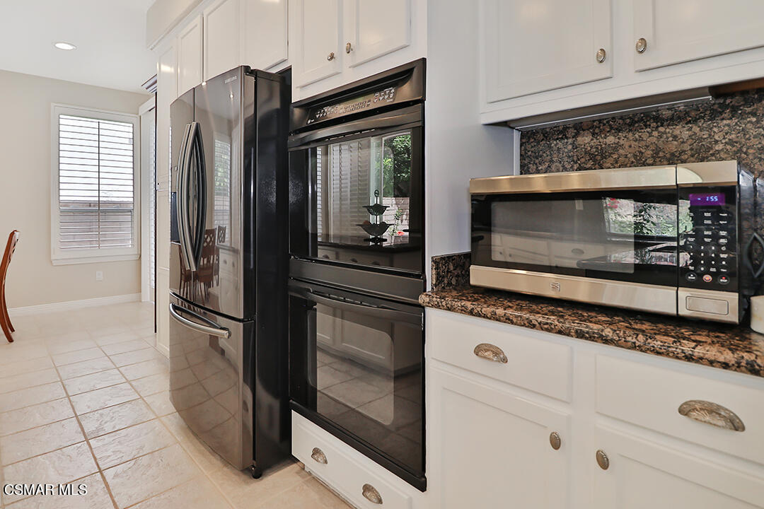 151 Brooks Road Simi Valley, CA 93065 - Photo 24 of 56 a kitchen with granite countertop a refrigerator and a stove