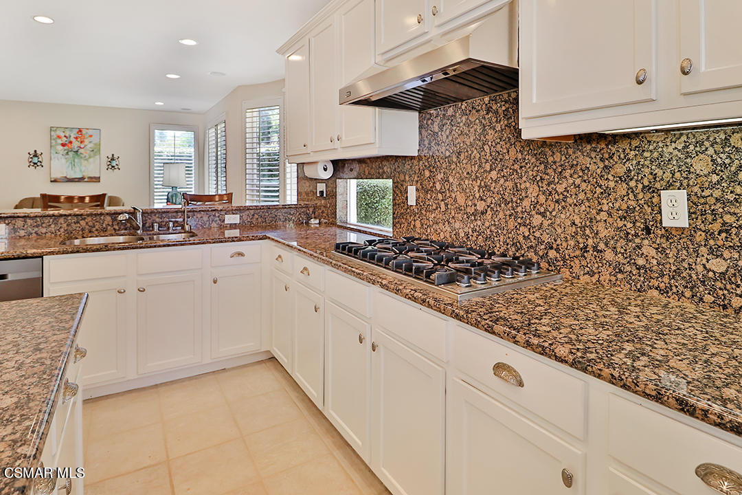 151 Brooks Road Simi Valley, CA 93065 - Photo 25 of 56 a kitchen with white cabinets and sink