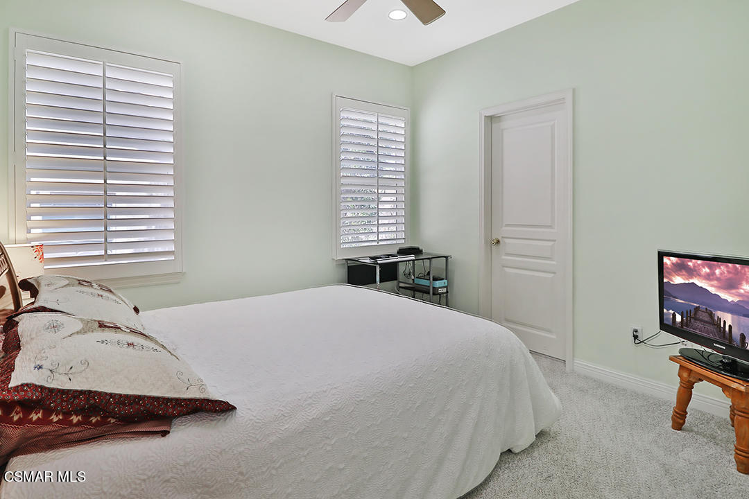 151 Brooks Road Simi Valley, CA 93065 - Photo 34 of 56 a bedroom with a bed and a flat screen tv