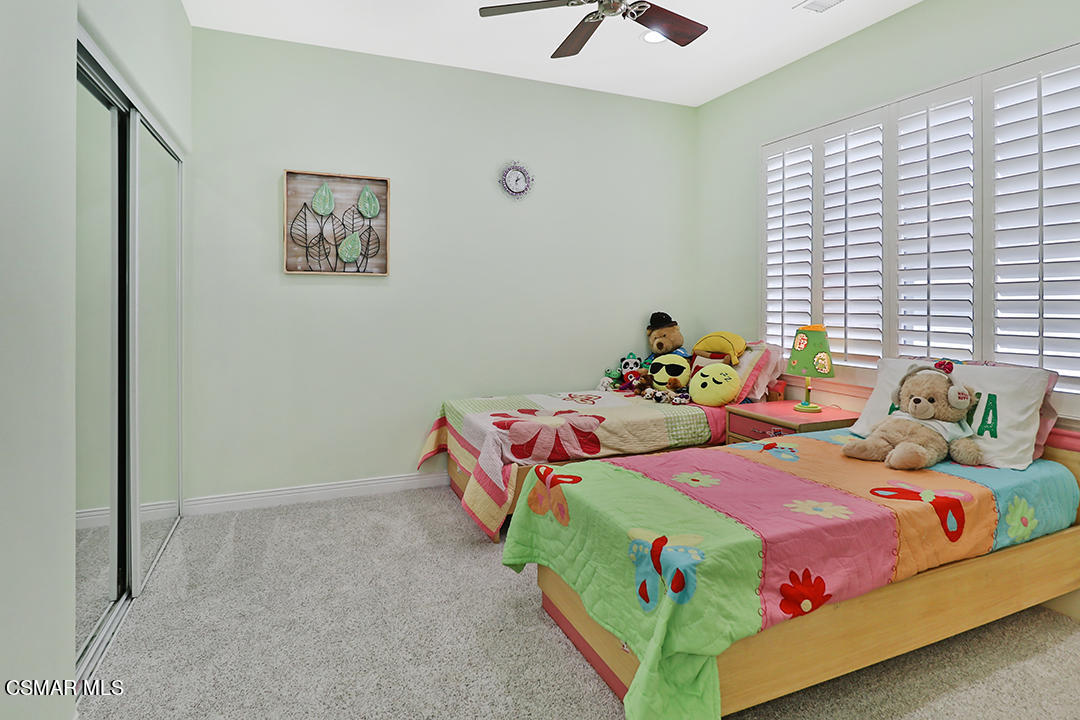 151 Brooks Road Simi Valley, CA 93065 - Photo 36 of 56 a bedroom with two beds and a chandelier