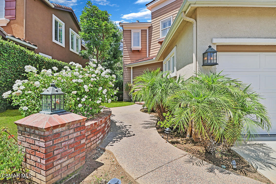 151 Brooks Road Simi Valley, CA 93065 - Photo 5 of 56 a couple of flower plants in front of a building