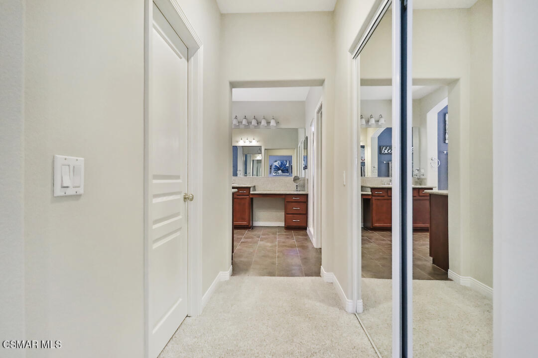 151 Brooks Road Simi Valley, CA 93065 - Photo 46 of 56 a view of a hallway with wooden floor and a living room