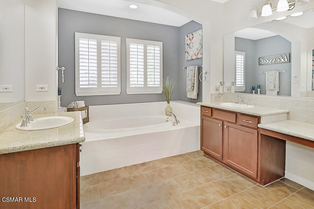 151 Brooks Road Simi Valley, CA 93065 - Photo 47 of 56 a spacious bathroom with a granite countertop sink and a bathtub