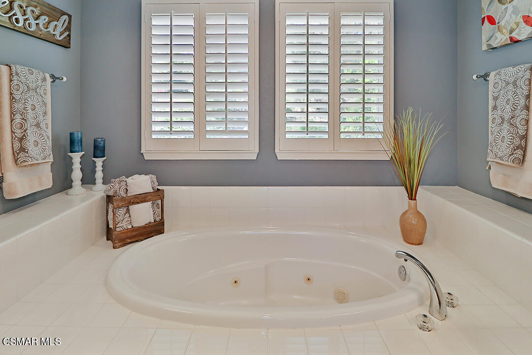 151 Brooks Road Simi Valley, CA 93065 - Photo 48 of 56 a white bath tub sitting in a bathroom next to a window