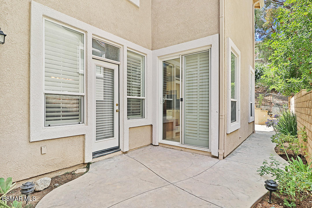 151 Brooks Road Simi Valley, CA 93065 - Photo 51 of 56 a view of a house with a large window and an outdoor space