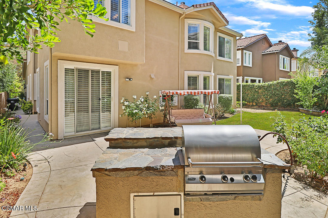 151 Brooks Road Simi Valley, CA 93065 - Photo 53 of 56 a front view of a house with a garden
