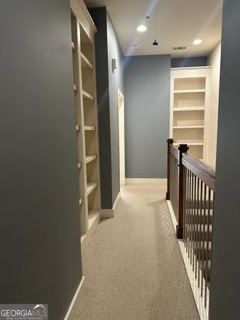 a view of hallway with stairs
