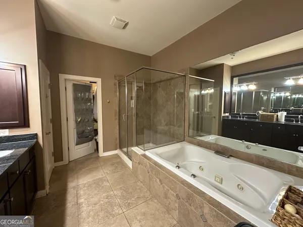 a bathroom with a bathtub and a sink