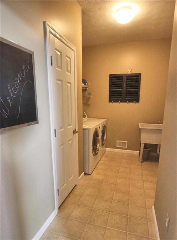 207 Maple Ridge Drive Canonsburg, PA 15317 - Photo 17 of 24 Bright, first floor laundry room with storage closet makes laundry no longer a chore
