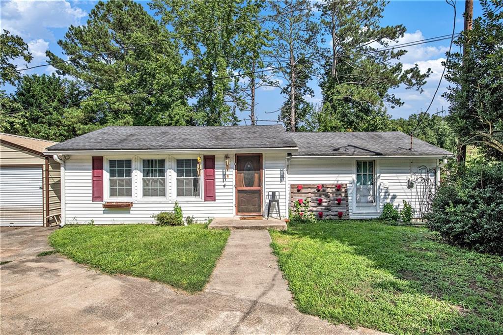 6111 Cedar Mountain Road Douglasville, GA 30134 - Photo 1 of 1 front view of a house with a yard