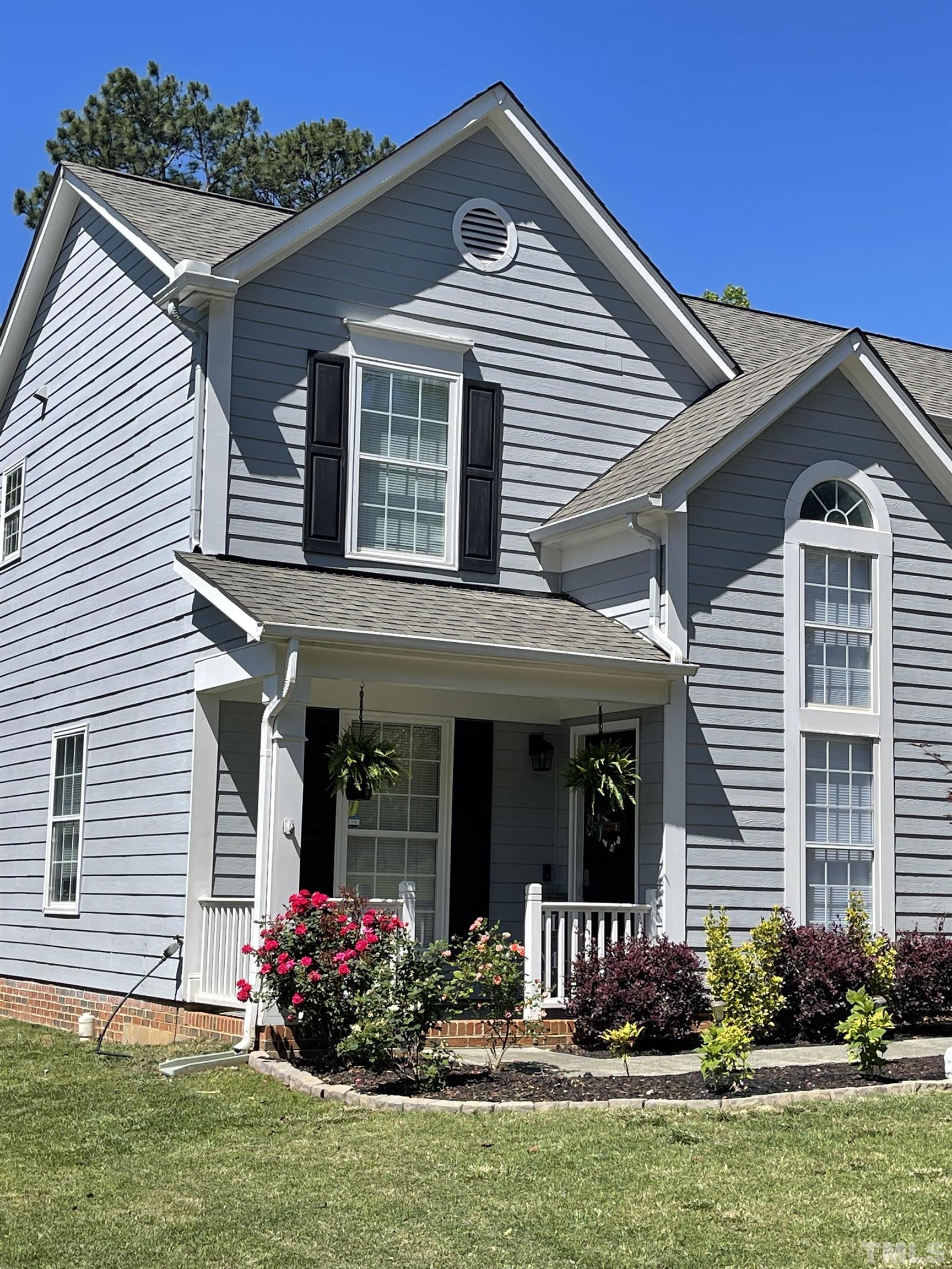 5333 Bartram Place Raleigh, NC 27617 - Photo 1 of 24 a front view of a house with garden