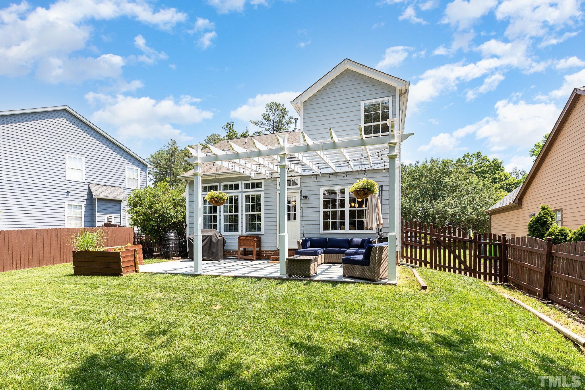 5333 Bartram Place Raleigh, NC 27617 - Photo 23 of 24 a front view of house with outdoor seating and barbeque oven