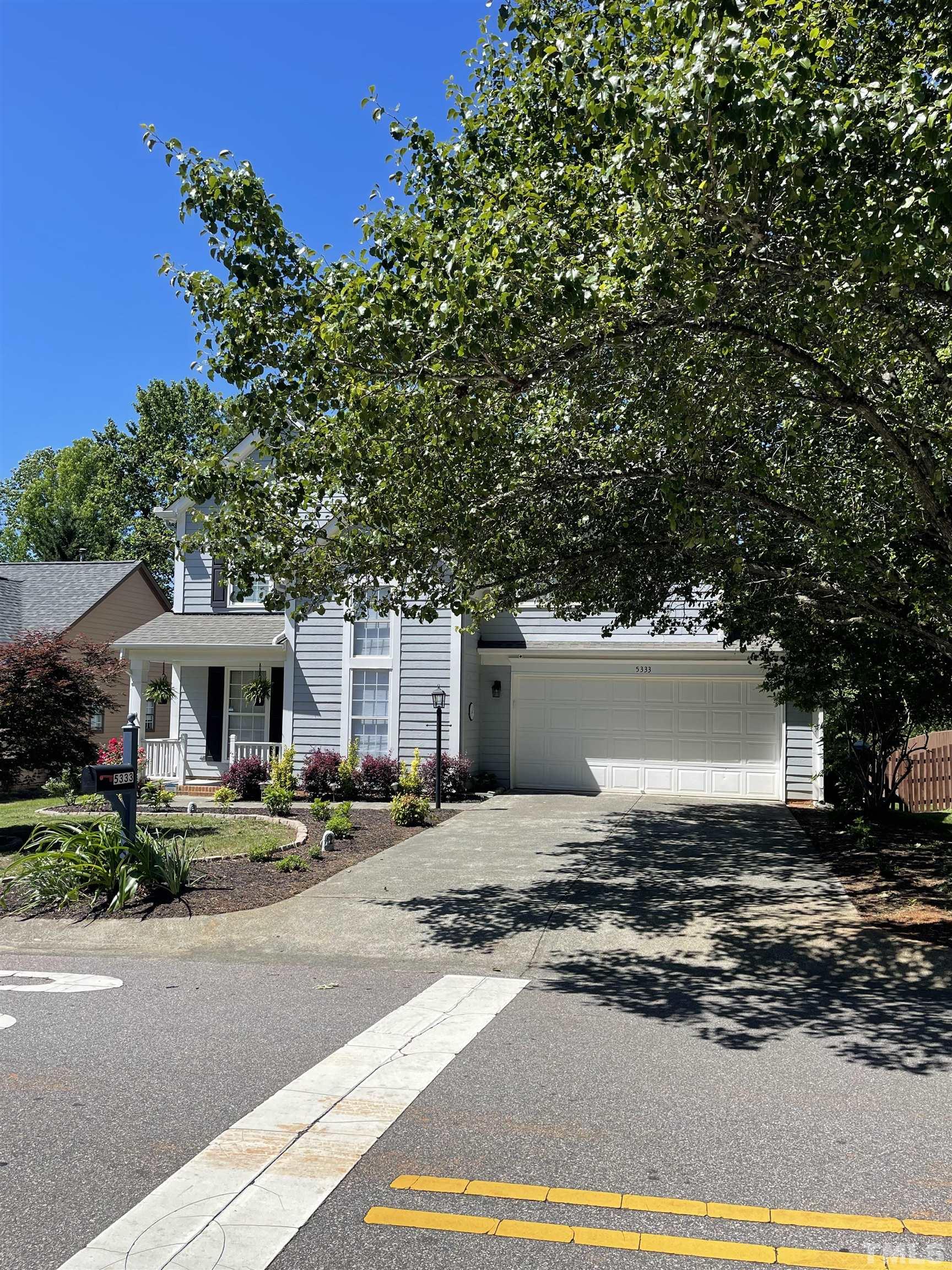 5333 Bartram Place Raleigh, NC 27617 - Photo 5 of 24 a view of a house with a yard